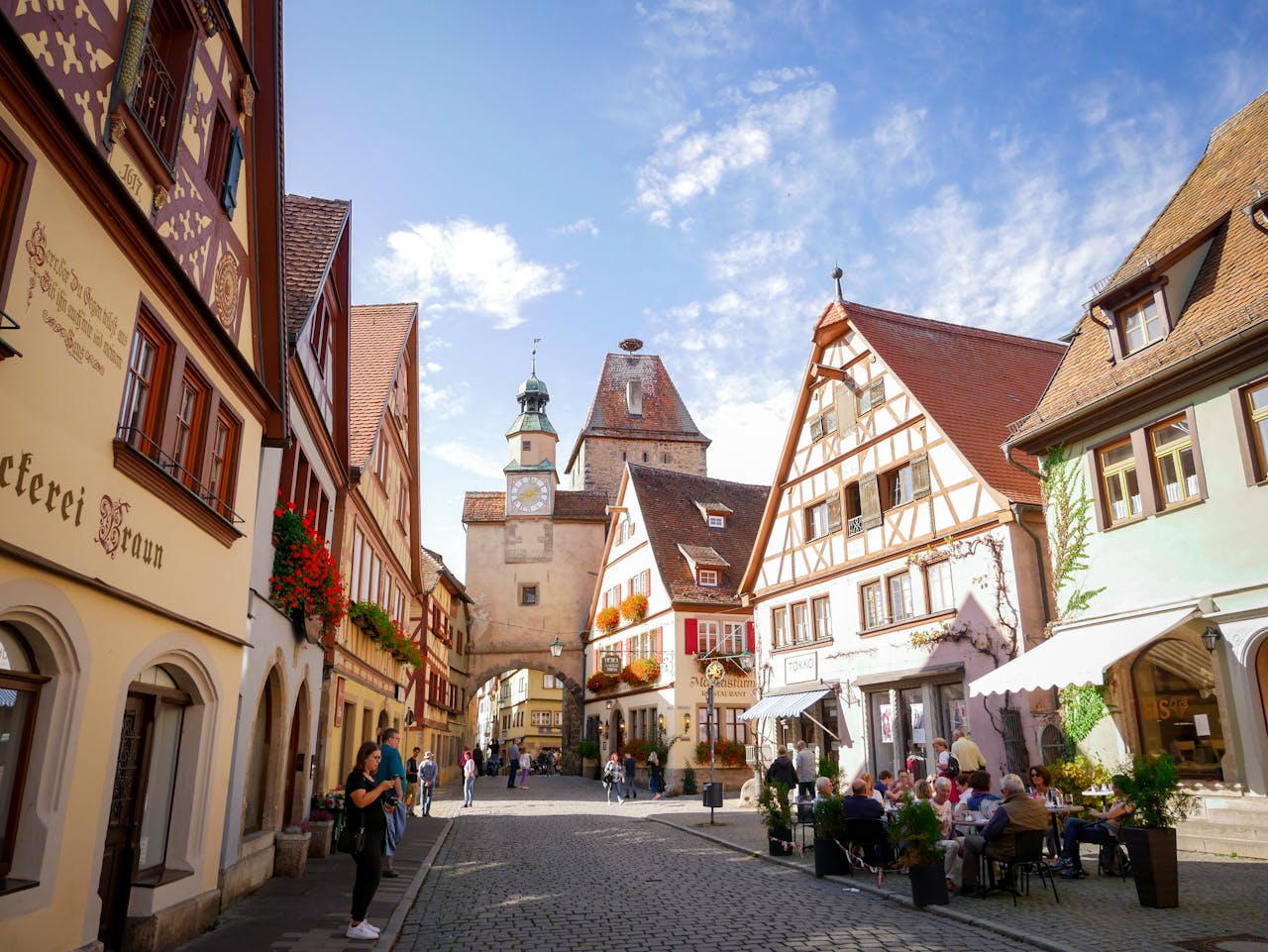 Picturesque cobblestone street in Rothenburg ob der Tauber showcasing traditional German architecture.